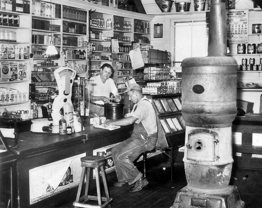 Criglersville general store owner Robert H. Gibbs served customer Lindsay Utz while they discussed topics of the day, 1956.