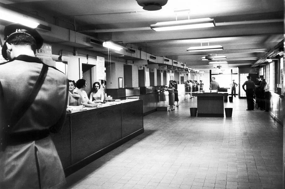 Employees of the Virginia Division of Motor Vehicles on West Broad Street in Richmond prepared for an onslaught of customers before doors opened for business, 1959.