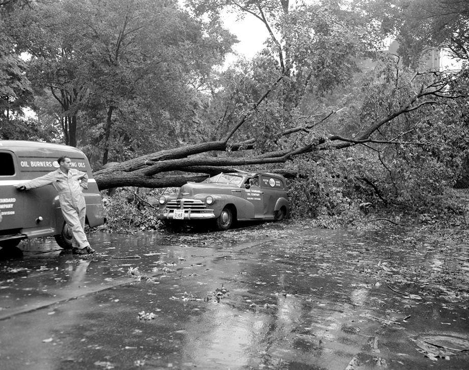 A tornado struck Richmond, causing massive damage in its 4-mile path of destruction --including a truck crushed by a fallen tree at Belvidere and Franklin streets downtown, 1951