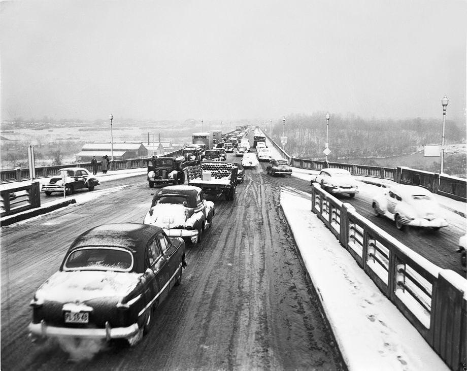 A surprise 5-inch snowfall covered Richmond and kept traffic on the slushy Lee Bridge moving slowly, 1950.