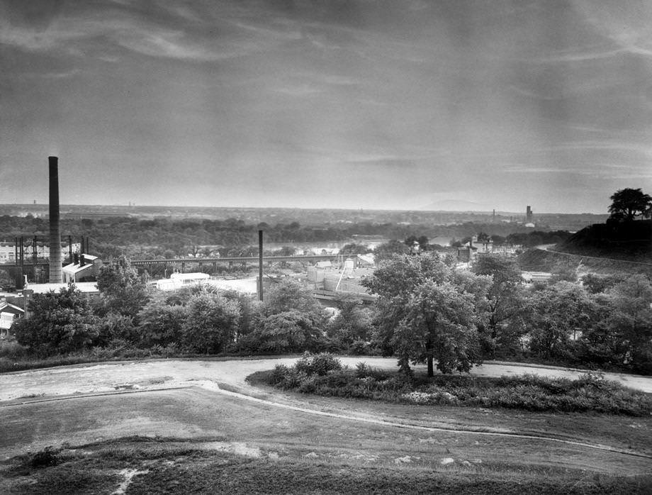 The view from Richmond’s Chimborazo Hill at twilight, looking across Fulton and the James River, 1955.