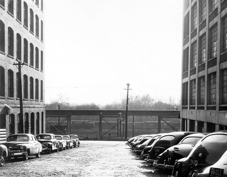 City Council was set to consider a request to abandon the stretch of 23rd Street between Cary and Dock streets, partially occupied by the railroad tracks seen in the distance, 1950.