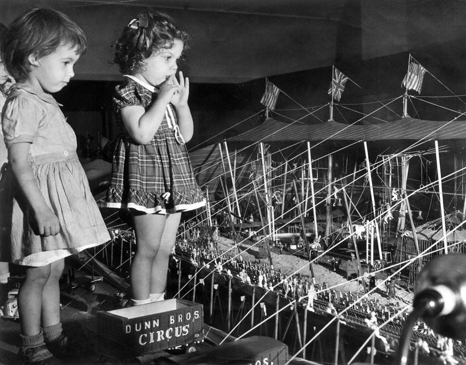 Two girls from the Belle Bryan Day Nursery visited Miller & Rhoads in downtown Richmond to see the Dunn Bros. miniature circus – “the biggest little show on Earth,” as it proclaimed itself, 1950.