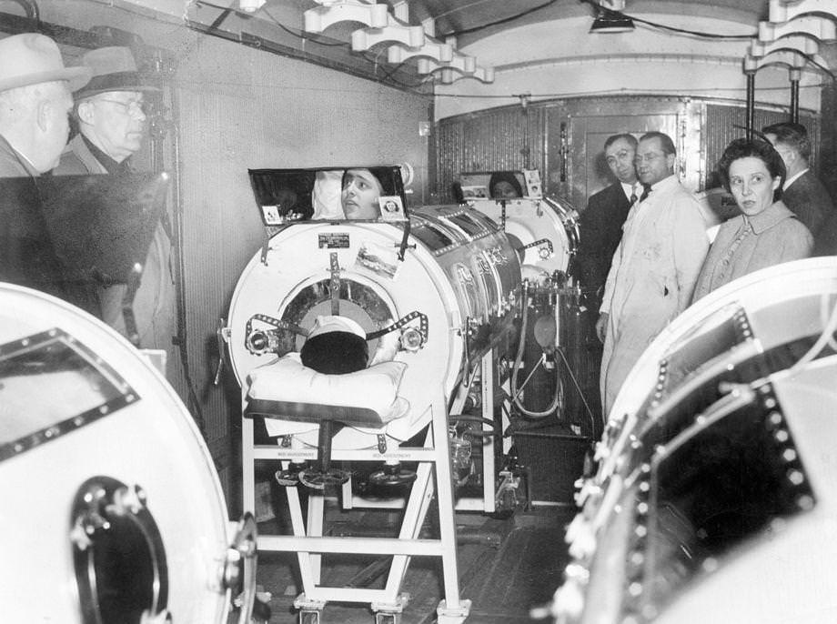 Three young polio patients in iron lungs were transported by truck and train from Roanoke to Richmond, where they could undergo long-range treatment at the Medical College of Virginia Hospital, 1951.