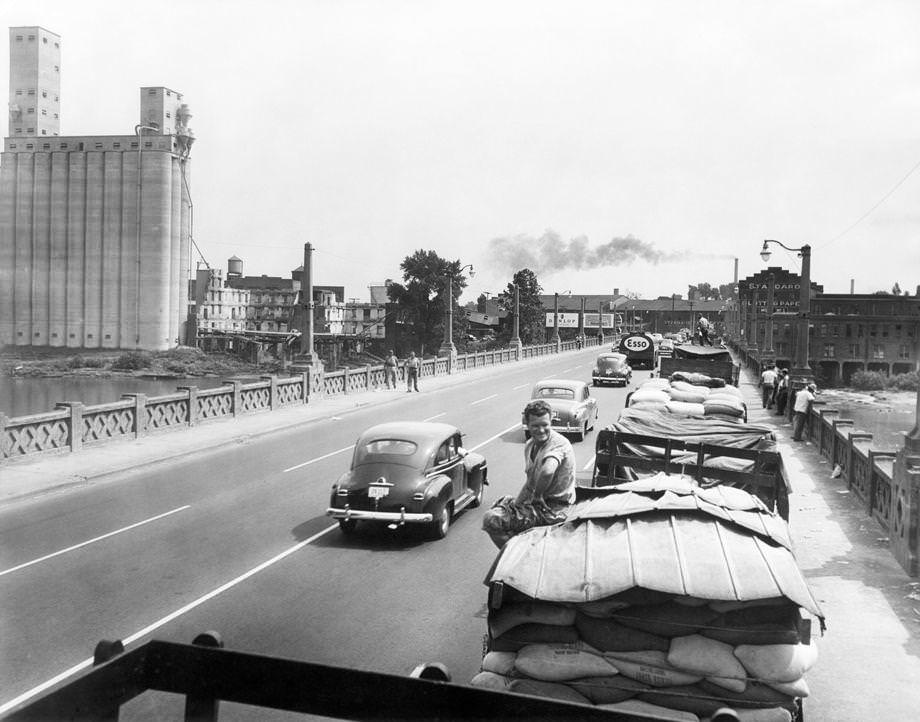 Trucks loaded with wheat during the harvest season had a long wait – including along the Mayo Bridge – to reach the Cargill Inc. grain elevator at First and Hull streets in South Richmond, 1952.