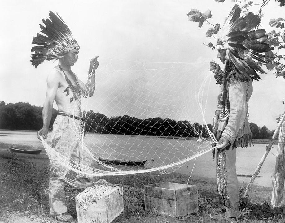 Willie Bradby (left) and Pamunkey Chief Tecumseh Deerfoot Cook checked a shad net on their reservation in King William County, 1950.