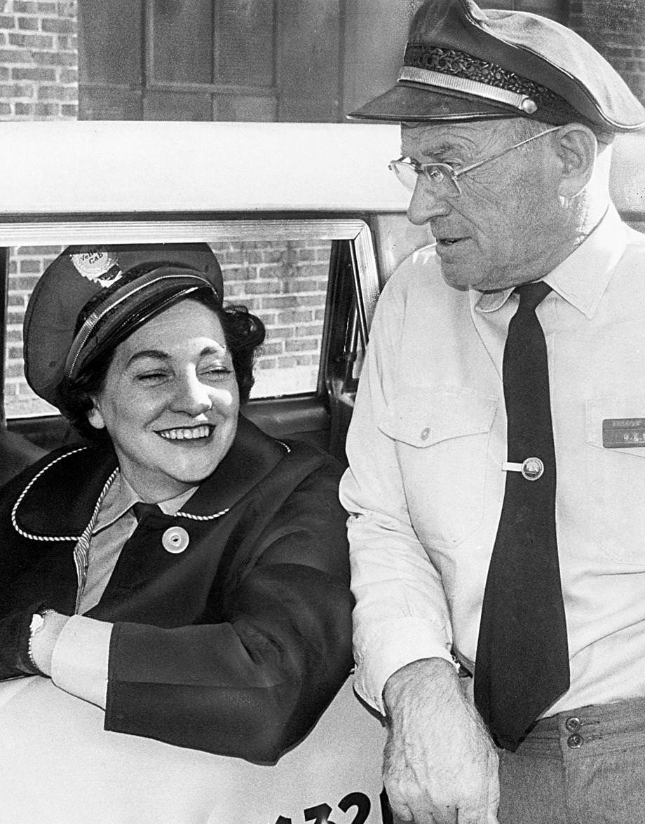 Jewell Mason, one of Richmond’s few female cab drivers, chatted with her husband, Otha, who also drove cabs, 1950s.