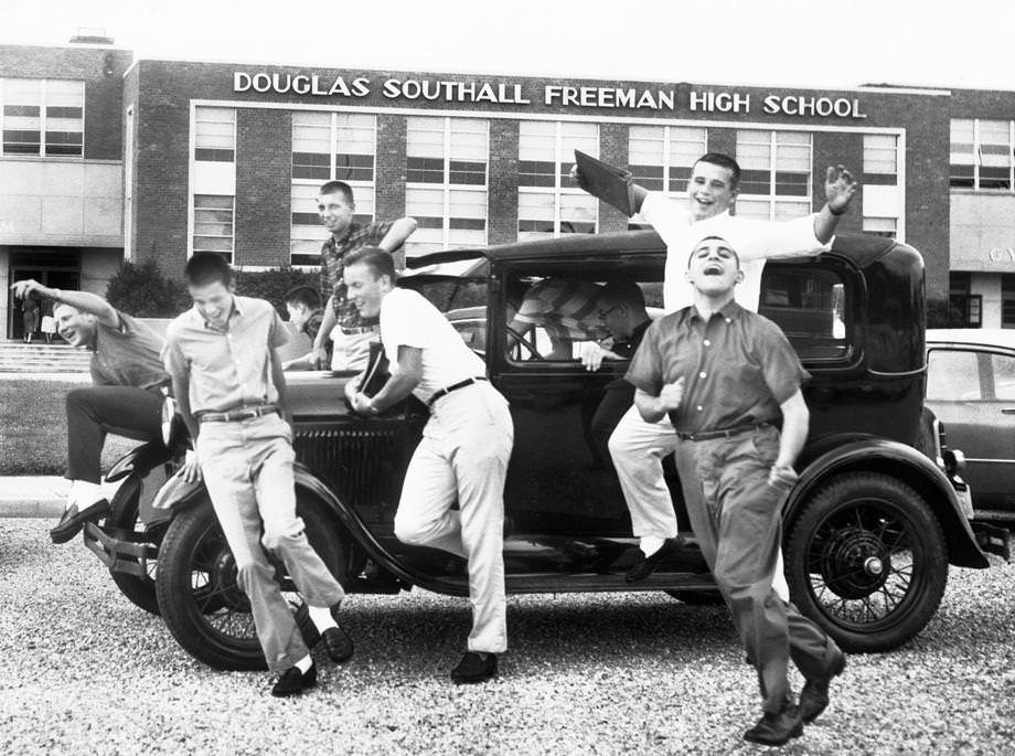 Jimmy Harrison gave some friends a ride to school in his antique car, 1959.