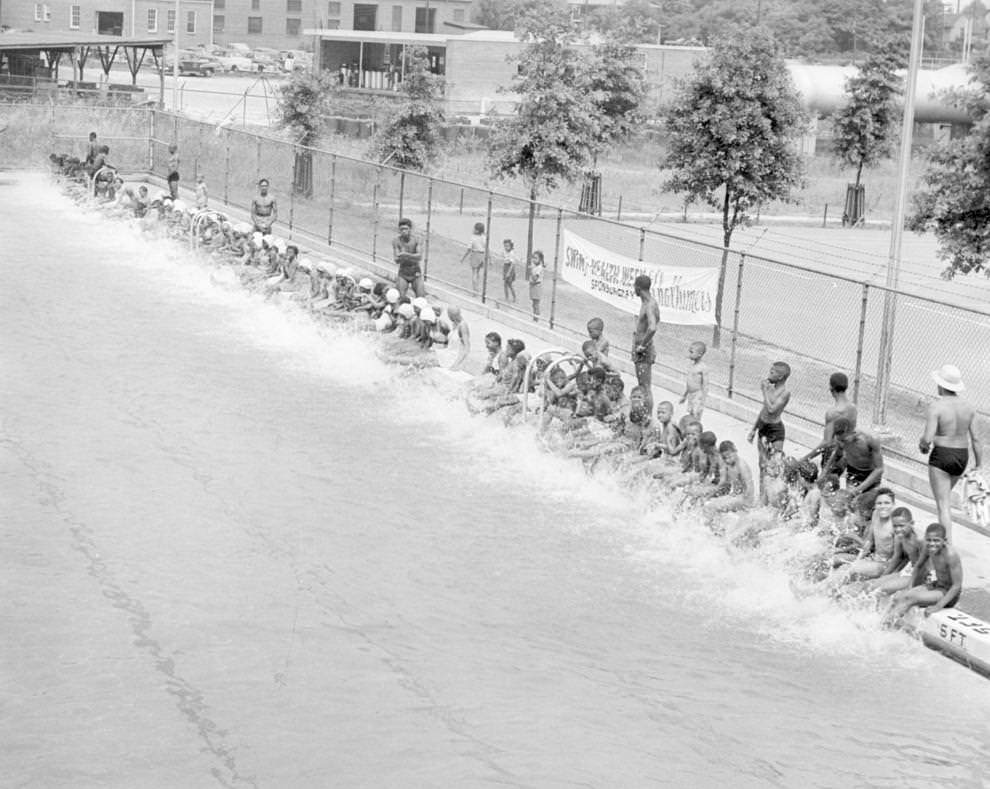 Children prepared for lessons at Brook Pool in Richmond as part of Swim for Health Week, 1950.