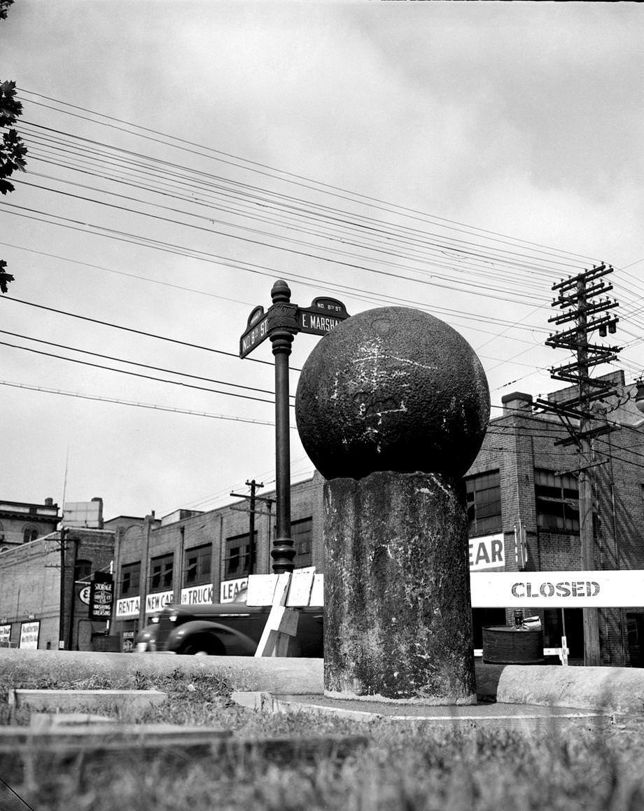 One of “Dr. Duval’s pills,” part of a trio of 30-inch granite Turkish cannonballs, in its new location at John Marshall High School at Eighth and Marshall streets in Richmond, 1952.