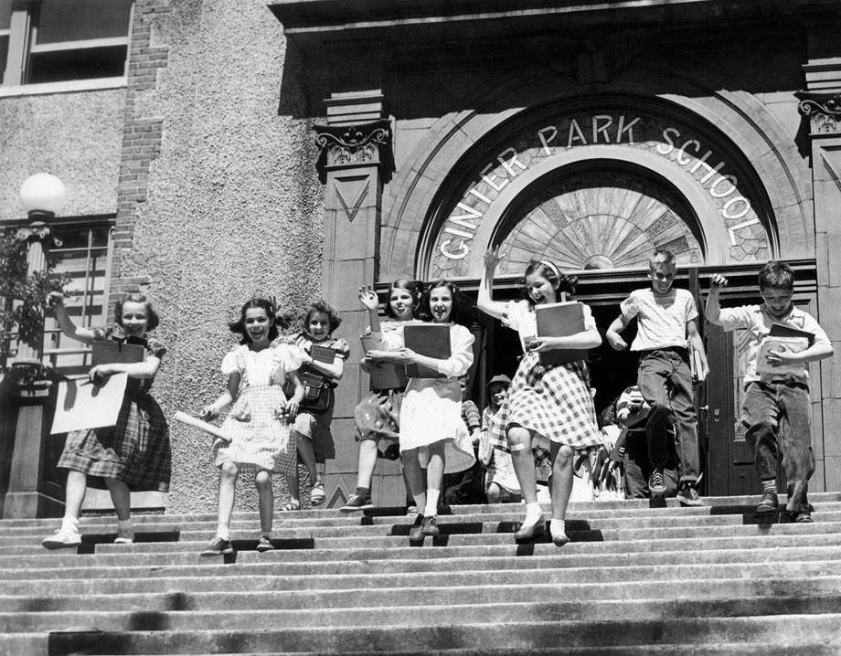 Gleeful children left Ginter Park School in Richmond as they were dismissed for the summer months – though they did need to return a few days later for their report cards, 1950.