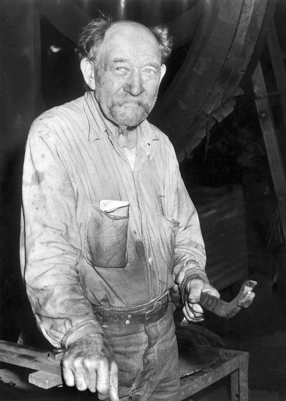 James R. Osterbind posed for a photo during his workday at Tredegar Iron Works in Richmond, 1953.