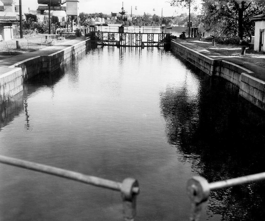 Shows the canal locks in downtown Richmond between 14th and Pear streets, 1953.