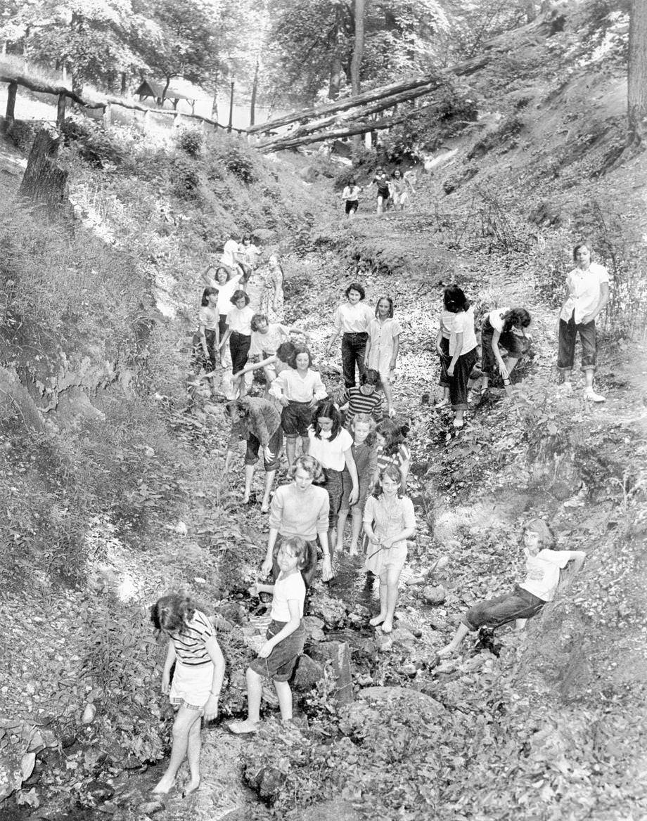 A school group followed a nature trail at Forest Hill Park in Richmond and explored a wildflower preserve and bird sanctuary, 1950.