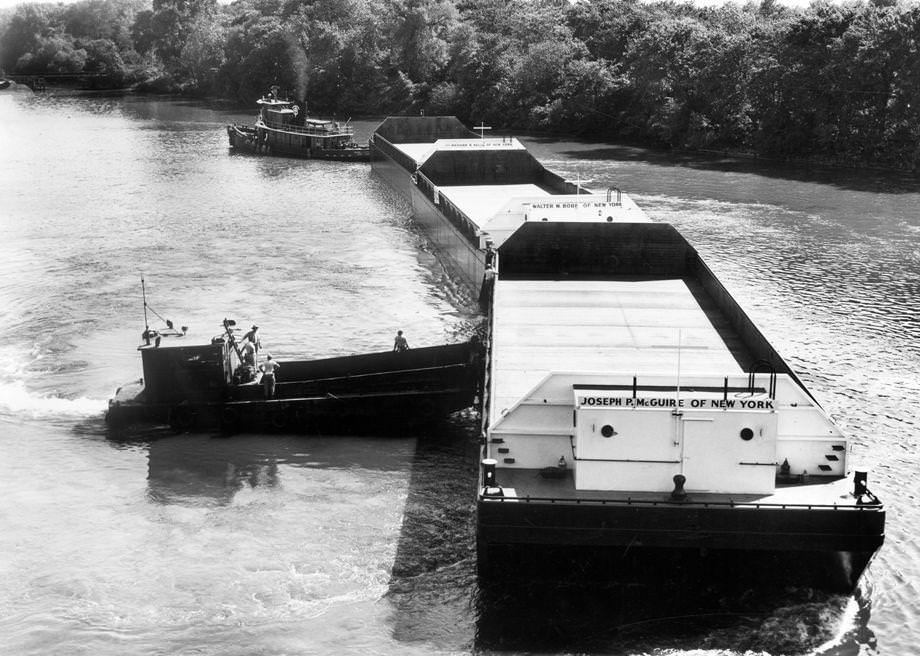 A tugboat from New York City left Richmond’s Upper Terminal with three steel barges in tow, 1955.