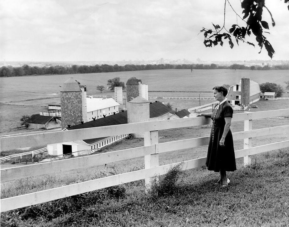 Mrs. Burlee stood on her front lawn at Tree Hill Farm in Henrico County’s Varina area and admired the view of Richmond, 1955.