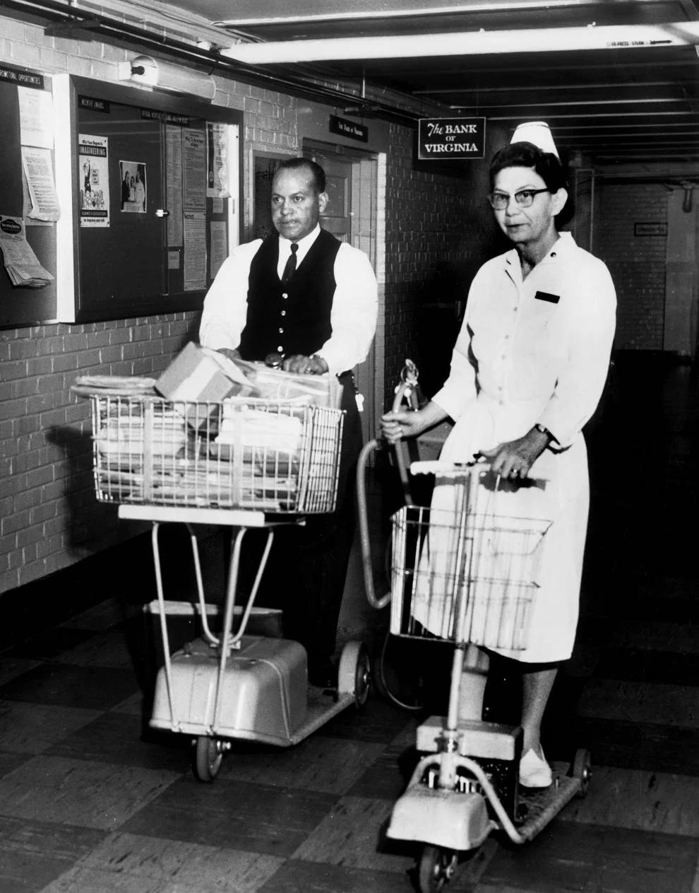 Charles W. Sykes and Freda S. Daniel of the McGuire Veterans Administration Hospital in Richmond used battery-powered scooters to take them from ward to ward, 1965.