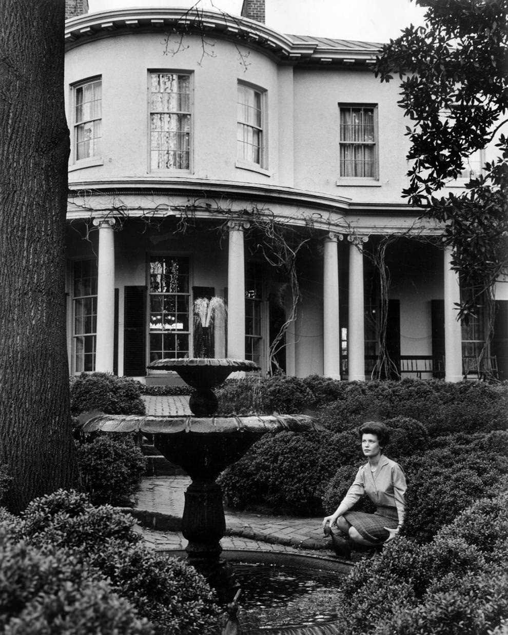 Nancy Beth Heller took a break from her duties at the Wickham-Valentine House in Richmond to enjoy the garden, 1968.