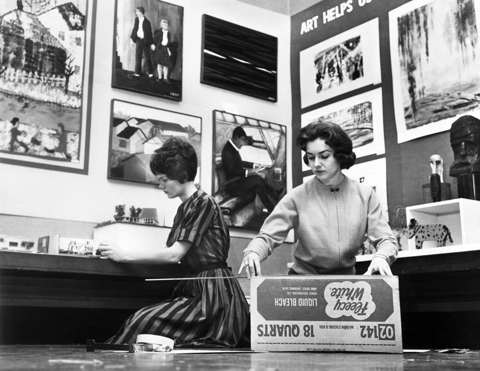 Art teachers Mrs. Richard T. Willis (left) and Gayle Dean unpacked student artwork for exhibition at The Valentine museum in downtown Richmond, 1963.