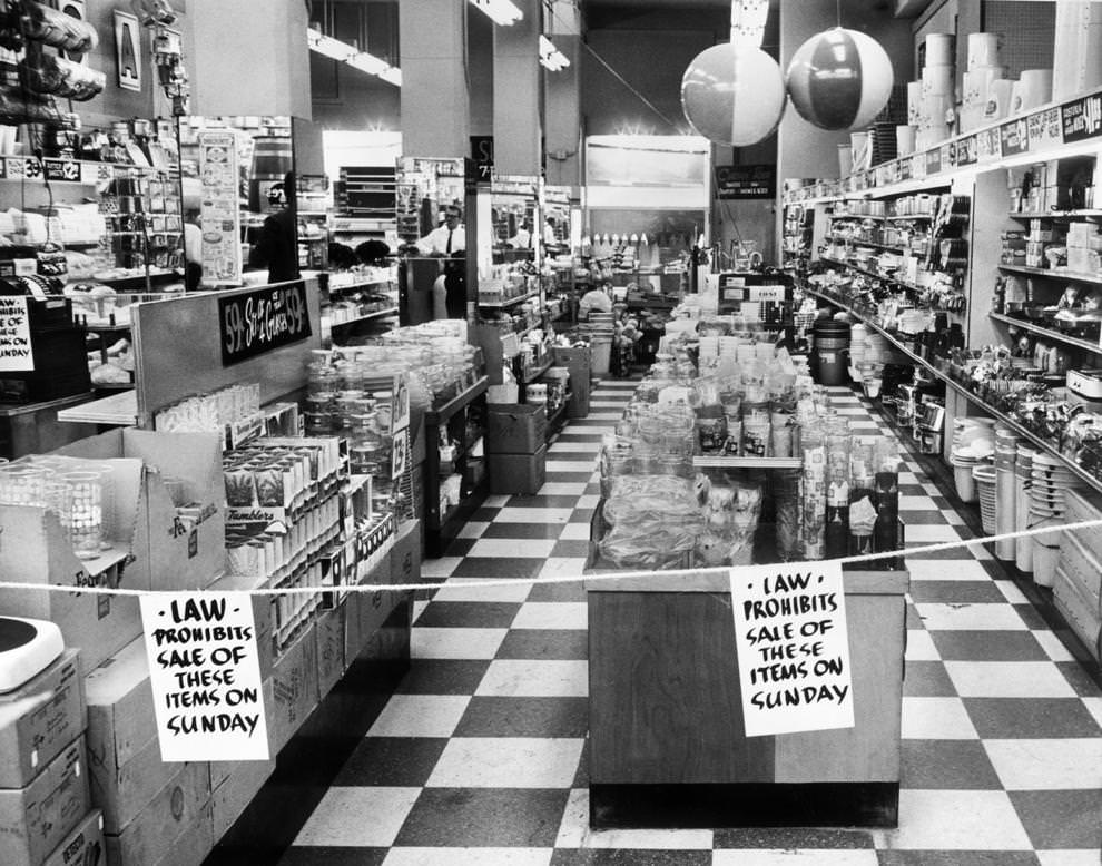A Richmond drugstore put up signs to reflect the recently enacted blue law, which prevented the sale of dry goods on Sundays, 1960.