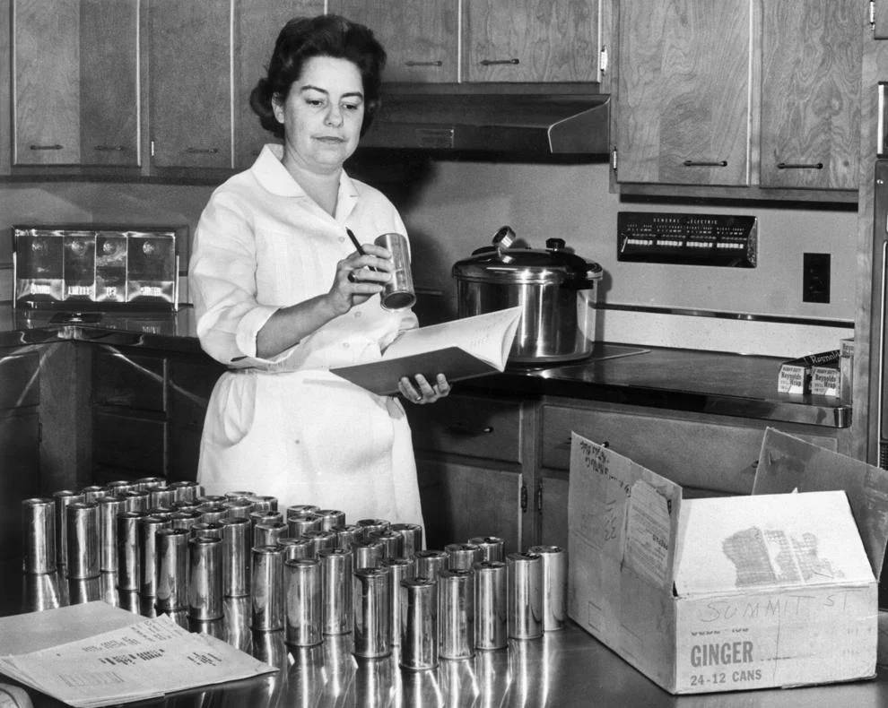 Mrs. William Cox recorded numbers from sample cans at a Reynolds Metals Co. test kitchen in Richmond, 1962.