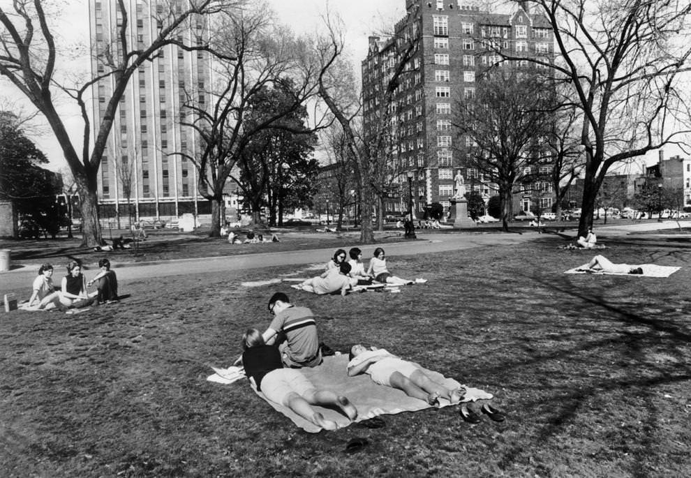 College students relaxed in the sun at Monroe Park in Richmond during a break from classes, 1968.