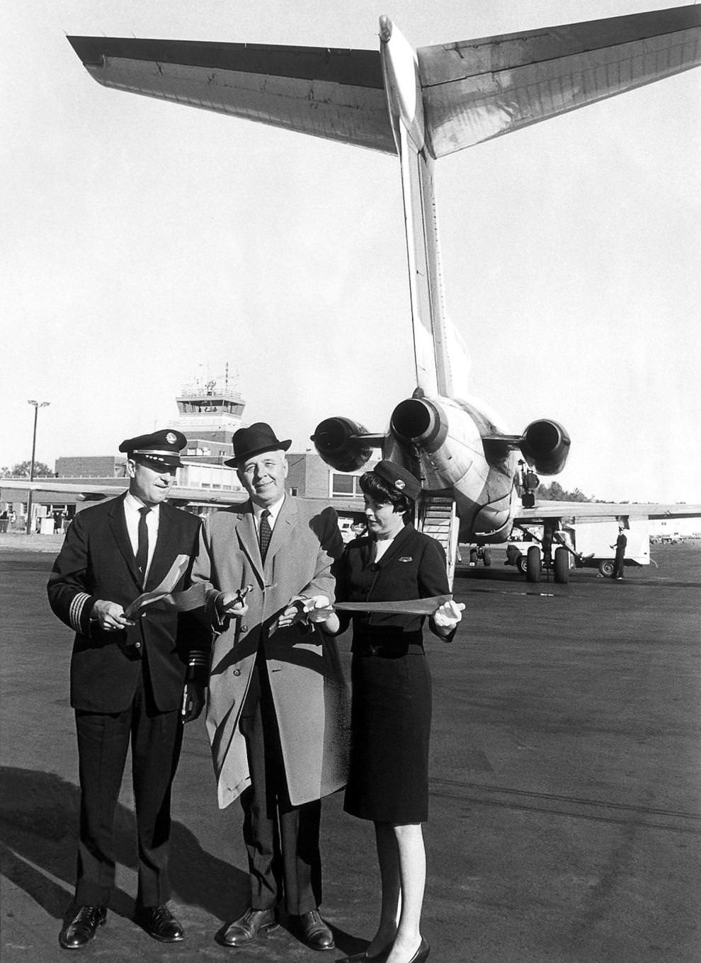 Richmond Mayor Morrill M. Crowe cut a ceremonial ribbon to mark the inauguration of the Eastern Airlines passenger service from Byrd Field to New York, 1965.