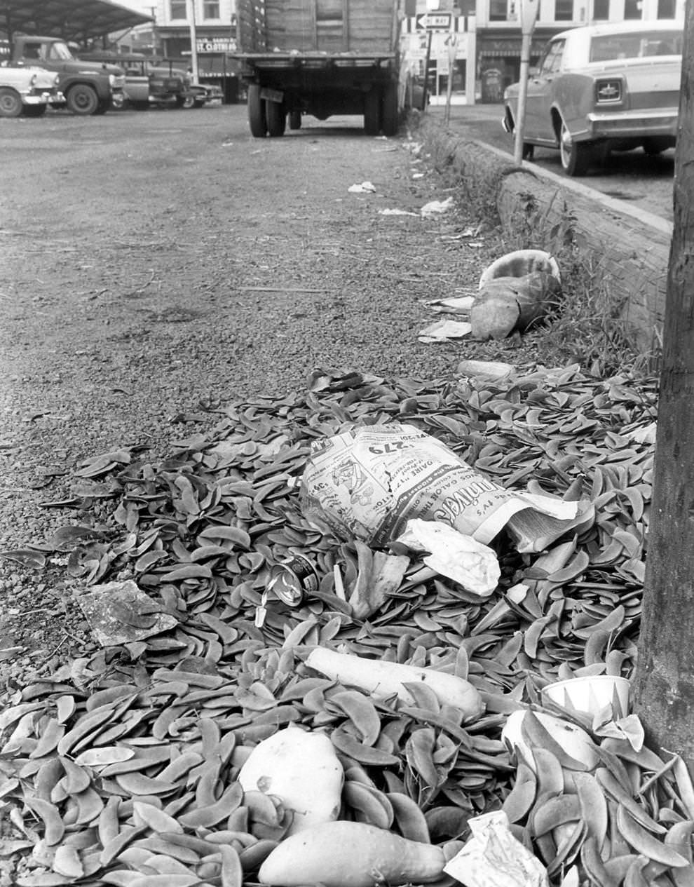 Trash was strewn along a street in downtown Richmond. In late June and early July, the eight-day “Fight Litter ’68” campaign gathered a cleanup force of 150 city workers and made progress in seven areas, 1968.