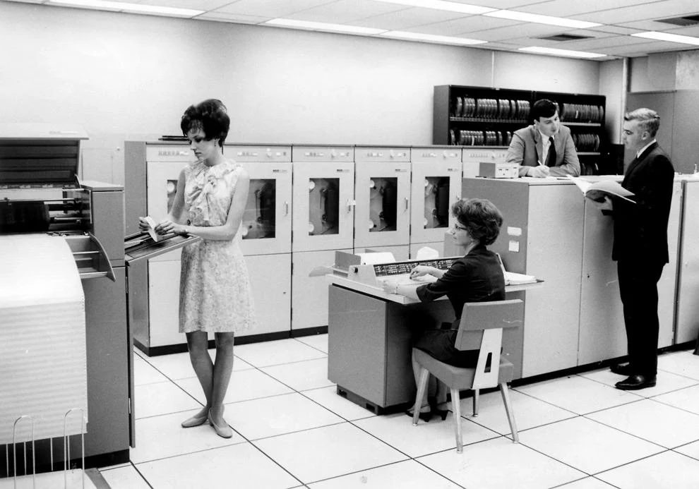 May 1968, Richmond Newspapers employees worked in the computer center housing the NCR 315, which eliminated some manual tasks in areas such as billing, payroll, classified advertising and circulation, 1968.