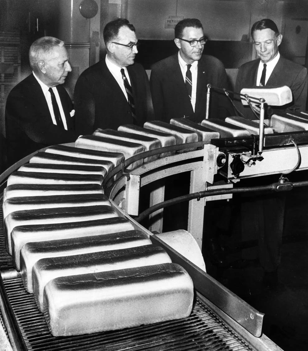 Members of the Nolde family – Henry (from left), George, Carl and Arthur – watched bread roll off the assembly line at the Nolde Bros, 1968.