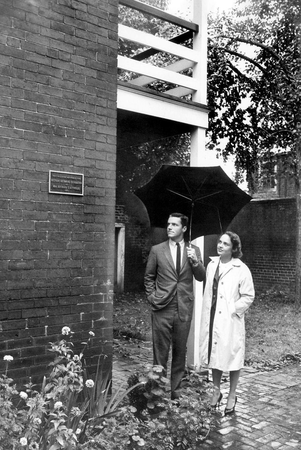 Frederic S. Bocock of the Historic Richmond Foundation and Mrs. Cornelius F. Florman stood in front of one of four new plaques honoring patrons of Church Hill renovations in Richmond, 1962.