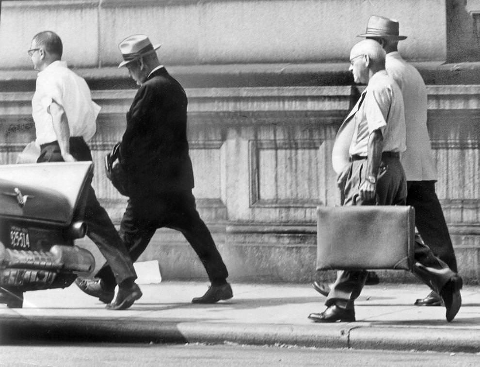 Harry L. Donovan (dark suit), his handcuffs covered by a jacket, was escorted from the U.S. Marshal’s Office in downtown Richmond, en route to a four-year term in federal prison in Atlanta, 1966.