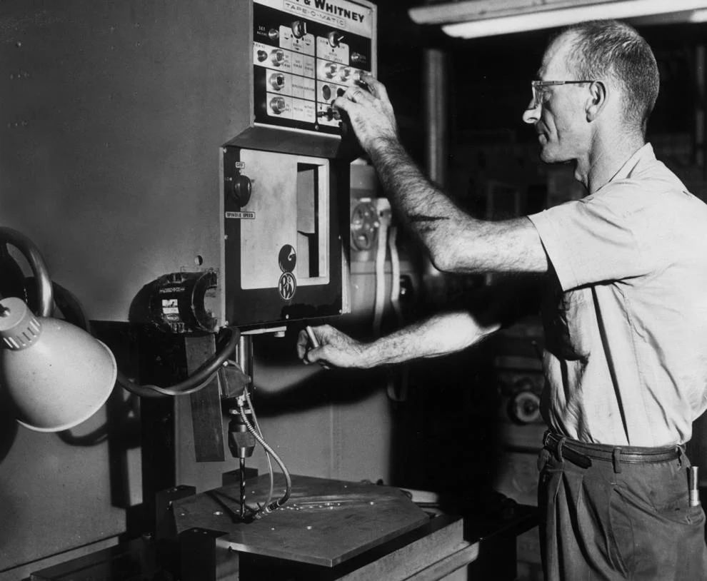 Bob Alexander, plant superintendent for West Engineering Co. in Richmond, operated a tape-controlled drill press, the first of its kind in the area, 1963.