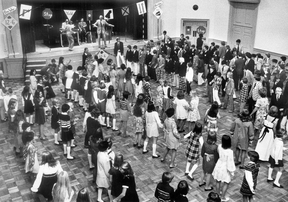 Boys and girls lined up at Town and Country Cotillion in Richmond’s West End to learn dance steps from instructor James Lowell, 1975.