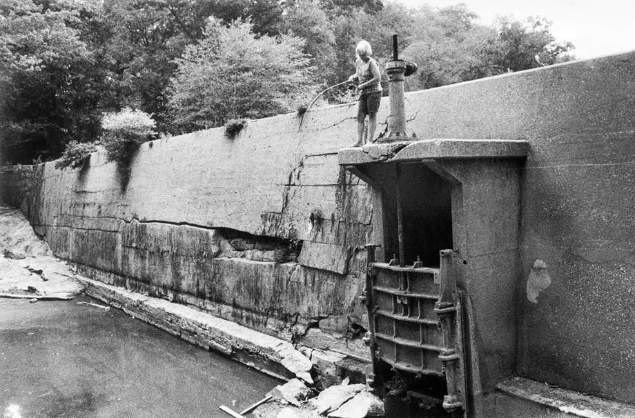 A boy fished at an old dam on the property of the Lakeside Country Club in Henrico County, 1974.