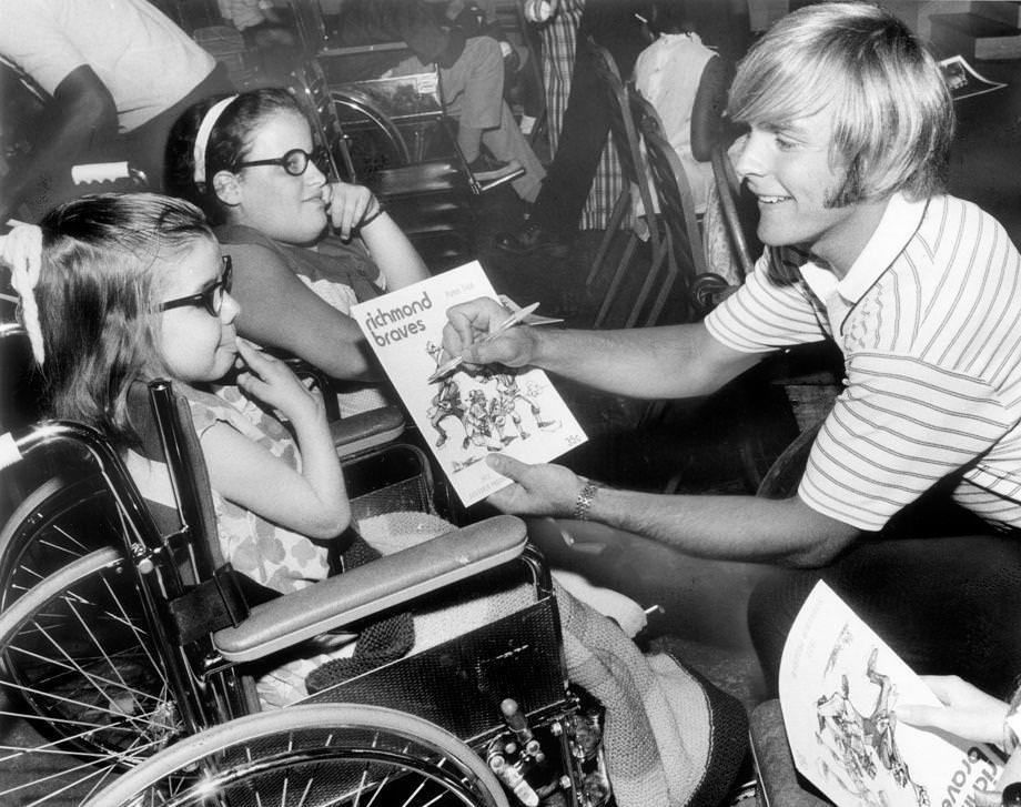 Richmond Braves baseball player Rod Gilbreath signed an autograph for Patricia Bowen, with fellow patient Cynthia McKay nearby, at the Crippled Children’s Hospital on Brook Road in Richmond, 1973.