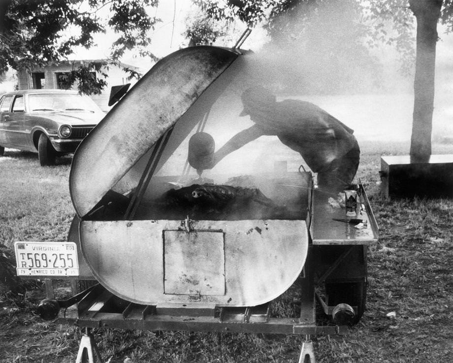 Vann Barden from North Carolina came to Richmond with his mobile smoke pit to put on a pig picking with friends, 1979.