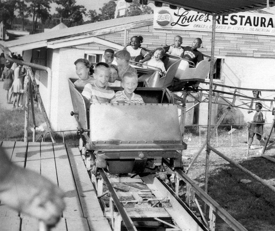 Children enjoyed a ride on a roller coaster at the 62nd annual Southside Virginia Fair, 1970.