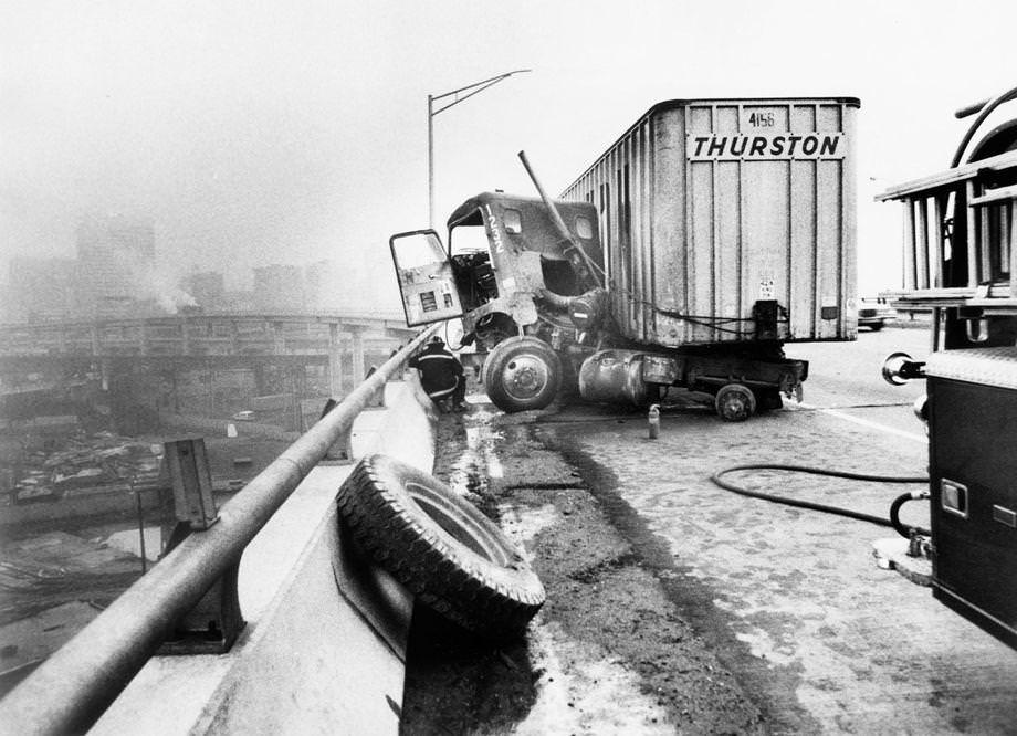 A tractor-trailer jackknifed after two wheels came off on the James River Bridge in Richmond, 1979.