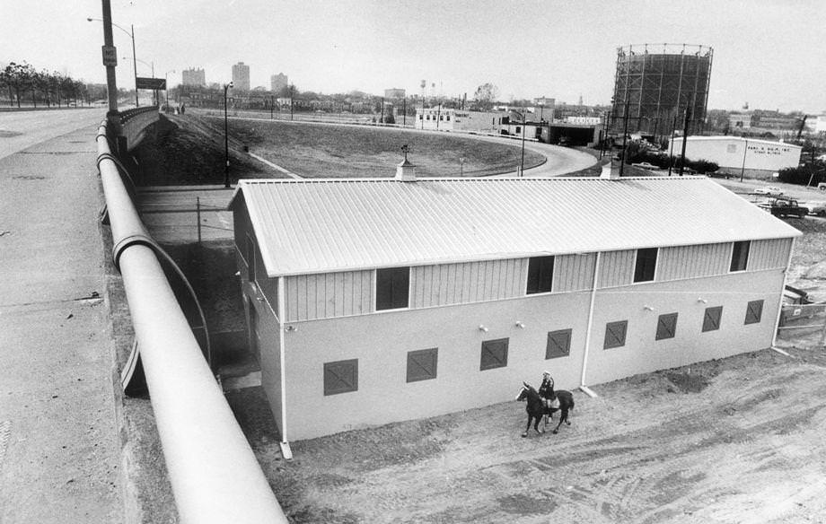A Richmond officer rode his horse by the police bureau’s new stables, which were under construction, 1970.
