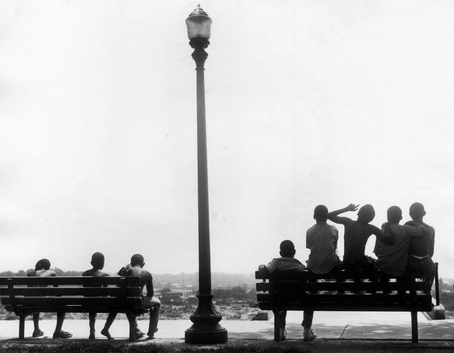 A group of children took a break from playing and sat on the bench at Chimborazo Park in Richmond, 1970.