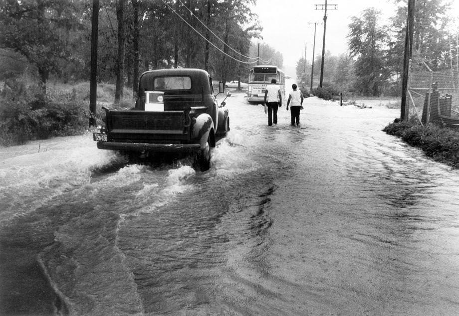Overflow from Reedy Creek flooded German School Road in South Richmond, 1970.
