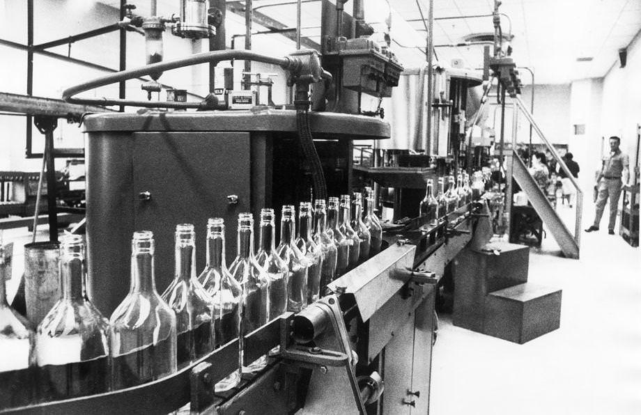 Bottles on an assembly line waited to be filled with Virginia Gentleman bourbon at the A. Smith Bowman Distillery in Reston in Fairfax County, 1970.