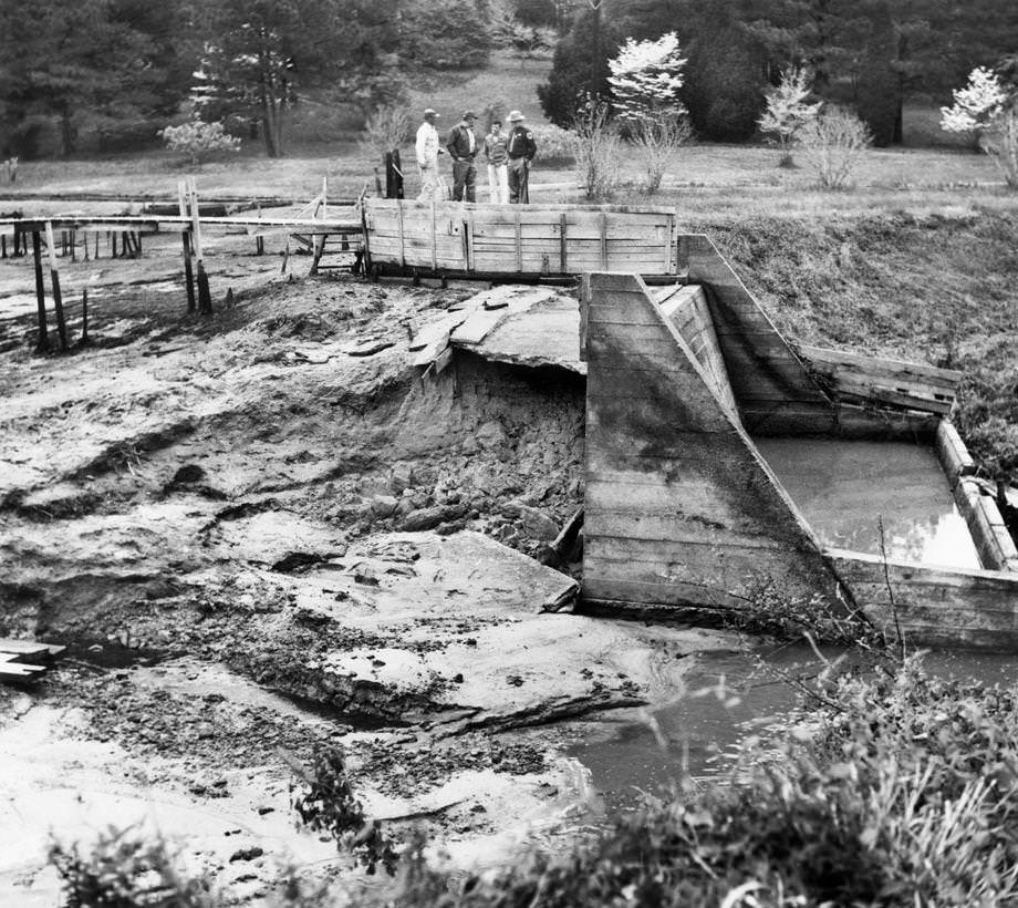 Gloucester County Sheriff Roland F. Smith and several county residents observed the dam at Burke’s Pond, which had collapsed for an unknown reason, 1970.
