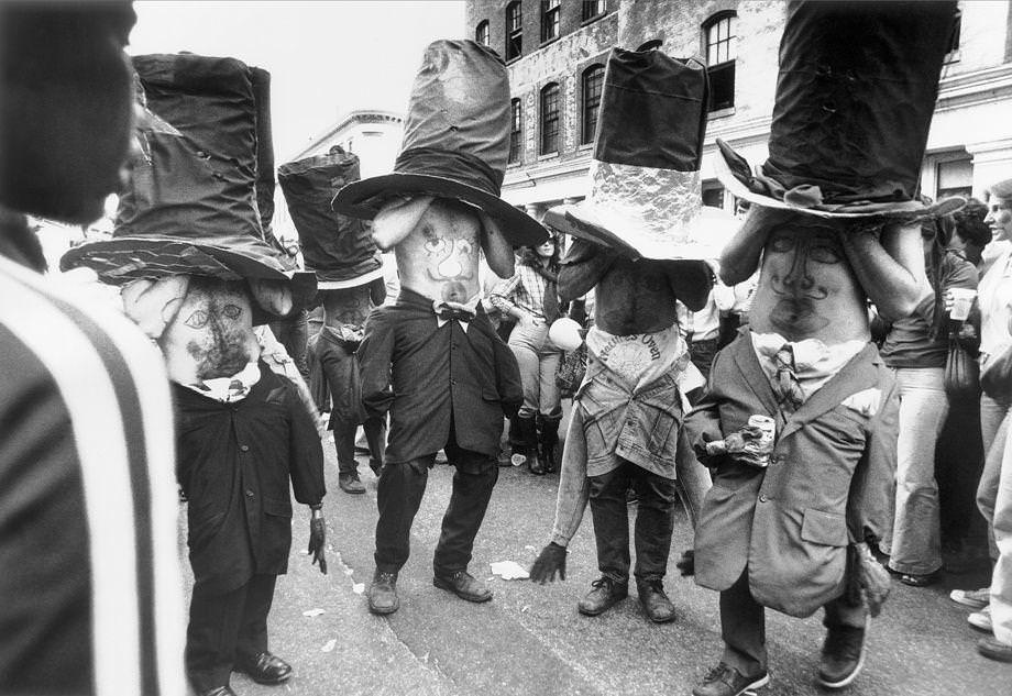 A group of mad hatters danced in Shockoe Slip during the Great Pumpkin Party. The Halloween-themed festival drew about 10,000 people, many of them in costume to participate in contests for cash prizes, 1978.