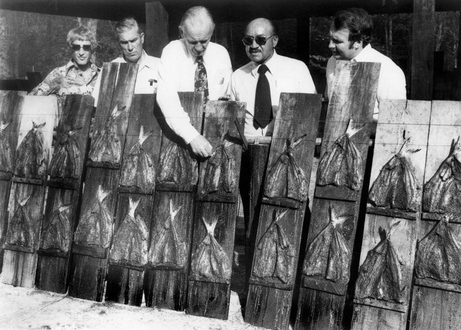 Men tended to the roasting planks at the 28th annual shad planking in Wakefield, an event in Sussex County that lured politicians, reporters, campaign workers and others to kick off the electoral season, 1976.