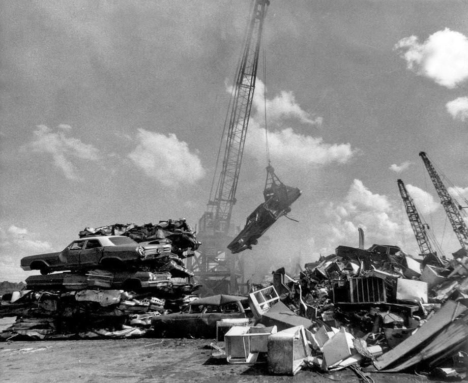 Cars and other scrap metal awaited shredding at Peck Iron and Metal Co. Inc., located off Commerce Road n South Richmond, 1976.