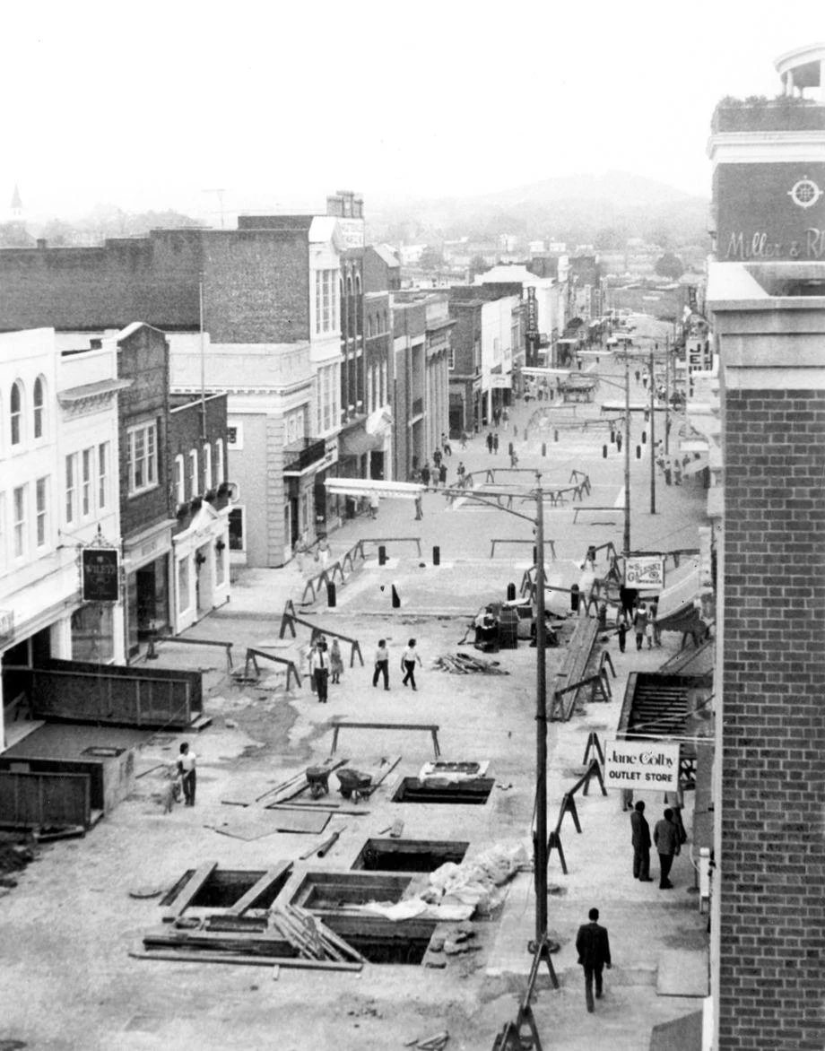 The Downtown Mall in Charlottesville was in the final phase of initial construction, with some of the square holes in the former Main Street slated to be filled with landscaping, 1975.