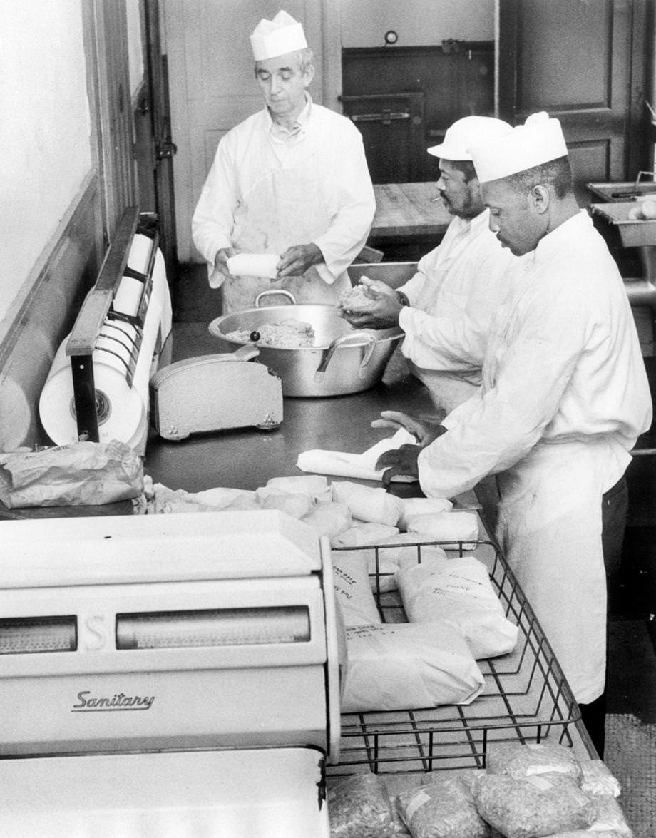 Butcher Homer Willis (from left) and assistants Clarence Gilliam and Joseph Scruggs prepared sausage at Willis’ Powhatan Locker Co., a small slaughterhouse and custom butcher shop off state Route 13 in Powhatan County, 1976.