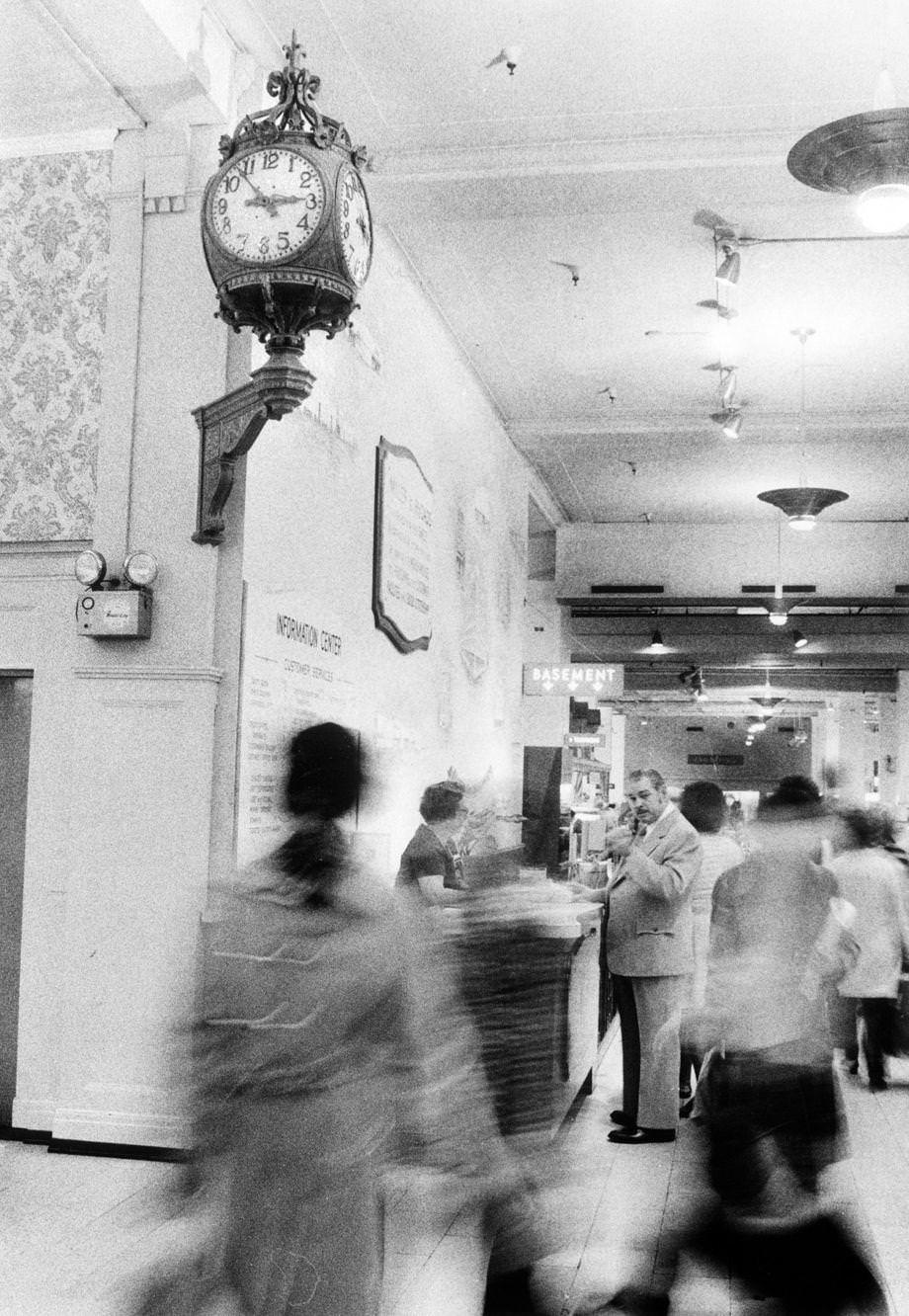 Shoppers passed by “the clock” at Miller & Rhoads in downtown Richmond, 1975.